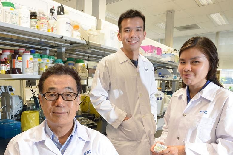 A*Star Experimental Therapeutics Centre's senior research scientist Masafumi Inoue (left) and research associates Gerald Yong and Karen Lee were part of the team behind the kit that can test for dengue, chikungunya and Zika at the same time.