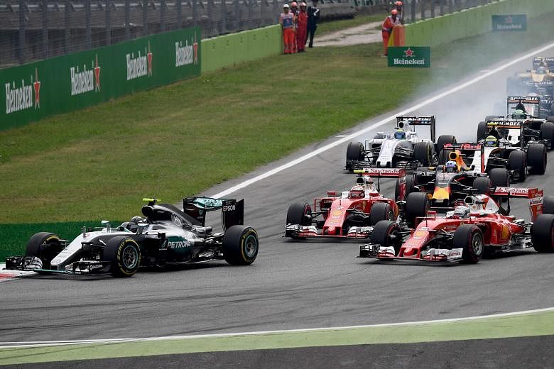 Mercedes' Nico Rosberg taking the lead ahead of both Ferraris after pole-sitter Lewis Hamilton had suffered yet another disappointing start in the opening seconds of the Italian Grand Prix on Sunday.