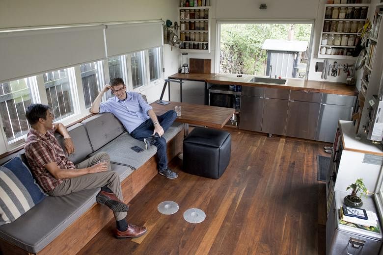 Mr Brian Levy (right) and Mr Chris VanArsdale (far right) are two of the owners of Minim Built, which will build and sell pre-fabricated micro houses (above).