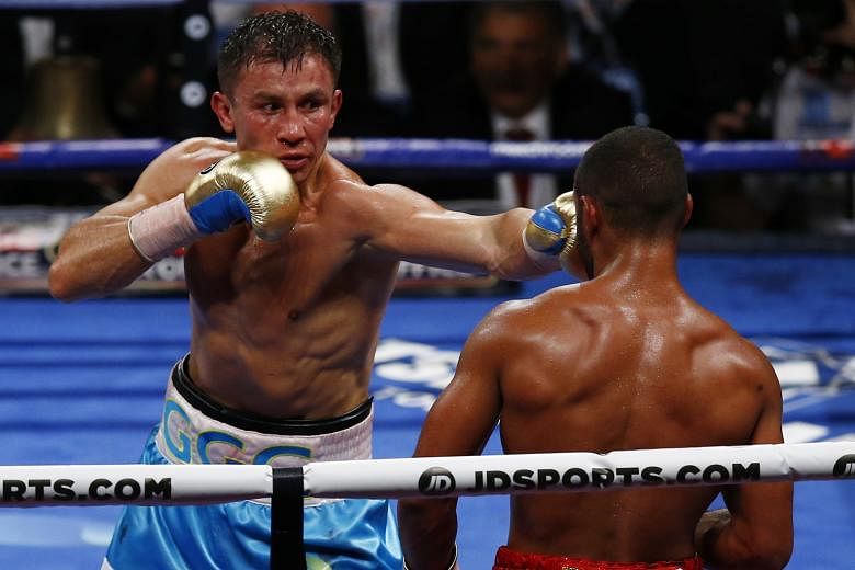 Gennady Golovkin punching Kell Brook during their WBC-IBF middleweight title fight on Saturday. Brook's camp threw in the towel.