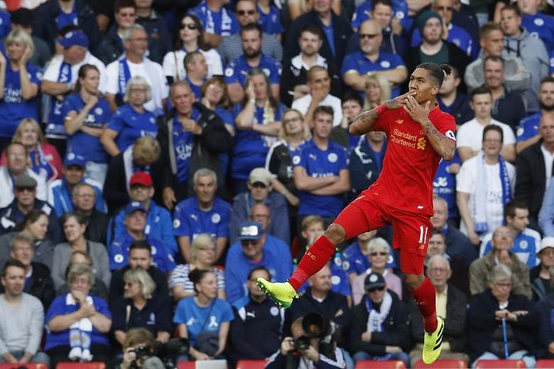Roberto Firmino celebrating after scoring his first goal in the Reds' 4-1 victory over Leicester City on Saturday. Jurgen Klopp said: "Please don't sing my name before the game is decided."