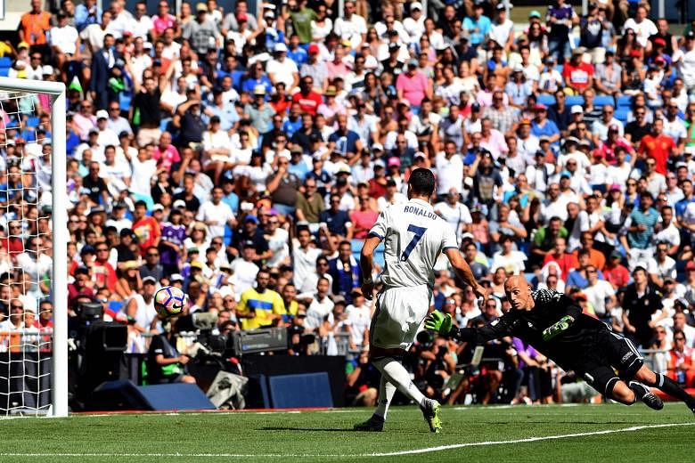 Cristiano Ronaldo scoring in the 5-2 La Liga win against Osasuna on Saturday. "Xavi has never won the Ballon d'Or, I have three," said the Portuguese.