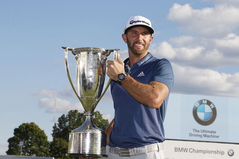 Dustin Johnson holding the Western Golf Association Trophy for winning the BMW Championship, his third win this year. The world No. 2 golfer will be in Atlanta in a fortnight to play in the season-ending US$10 million Tour Championship.