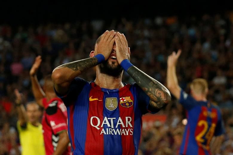 Aleix Vidal showing the strain with Barcelona heading for a 2-1 reverse against Alaves in La Liga. Manager Luis Enrique dismissed rumours of a split in his squad over his move to make eight changes to the team ahead of tonight's European game against