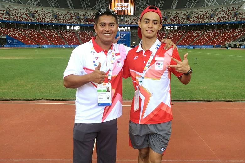 Muhamad Hosni (left) says Suhairi Suhani is one of the few athletes he has coached to bargain for shorter breaks. The coach said, however, that the long jumper getting a job might stand in the way of him training full-time.
