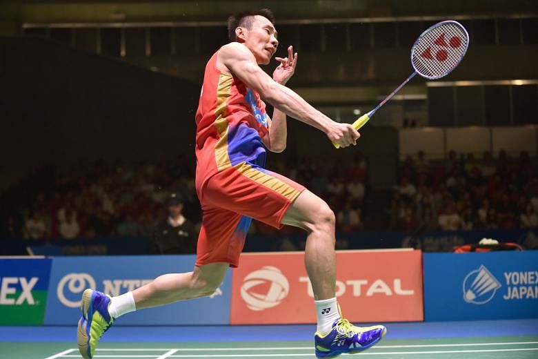 Malaysia's Lee Chong Wei smashing at Denmark's Jan Jorgensen in the Japan Open final yesterday. His win gave him his 65th career badminton title.