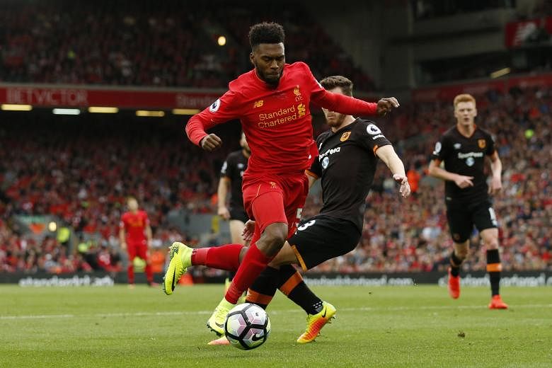 Substitute Daniel Sturridge earning Liverpool a penalty against Hull City's Andrew Robertson, who was taken in by the striker's dancing feet and brought him down. James Milner scored his second spot kick of the game to complete the Reds' 5-1 win, han