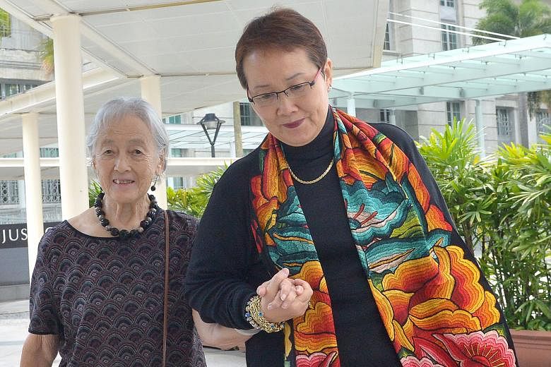 Madam Mok and her aunt, Madam Chung, making their way to court yesterday. Madam Mok said she did not know the full extent of what Yang Yin had done "until it was too late".