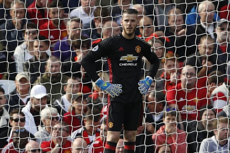 A dejected- looking United goalkeeper David de Gea, whose fumble led to Stoke's equaliser at Old Trafford late in the game. Anthony Martial had given the home team the lead with his first goal of the season. The point moved Stoke up into 19th spot wh