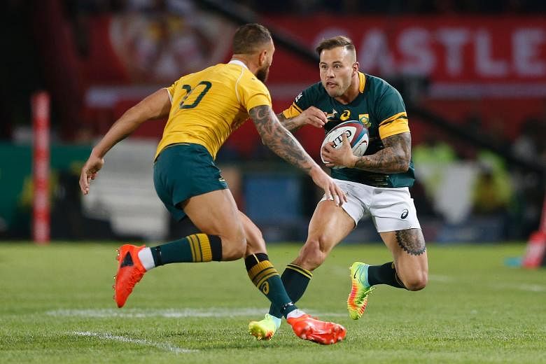 South Africa wing Francois Hougaard trying to get past Australia fly-half Quade Cooper during their Rugby Championship match in Pretoria, which the Springboks won 18-10. New Zealand have won the title but South Africa and Australia can both secure se