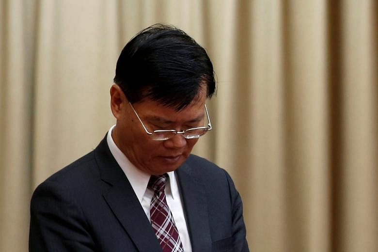 Mr Ding says he resigned to maintain his innocence and end damage to the financial watchdog.