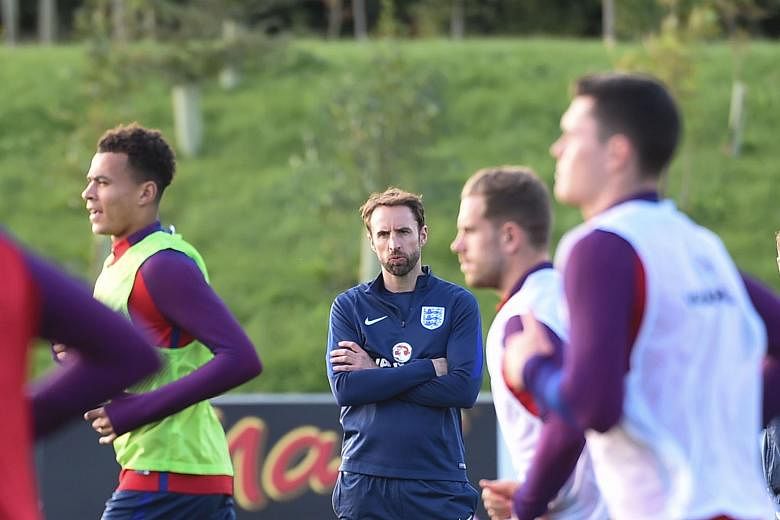 England caretaker manager Gareth Southgate overseeing training at St George's Park. He often employed a diamond midfield formation with the Under-21s and may use similar tactics in tomorrow's World Cup qualifier against minnows Malta at Wembley.