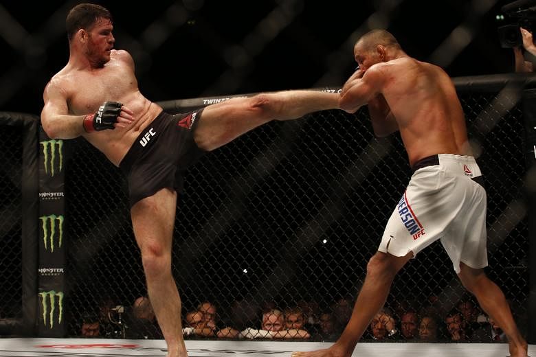 Michael Bisping kicking Dan Henderson during the bout, which all three judges gave to the middleweight defending champion. This was the 46-year-old Henderson's final pro fight.
