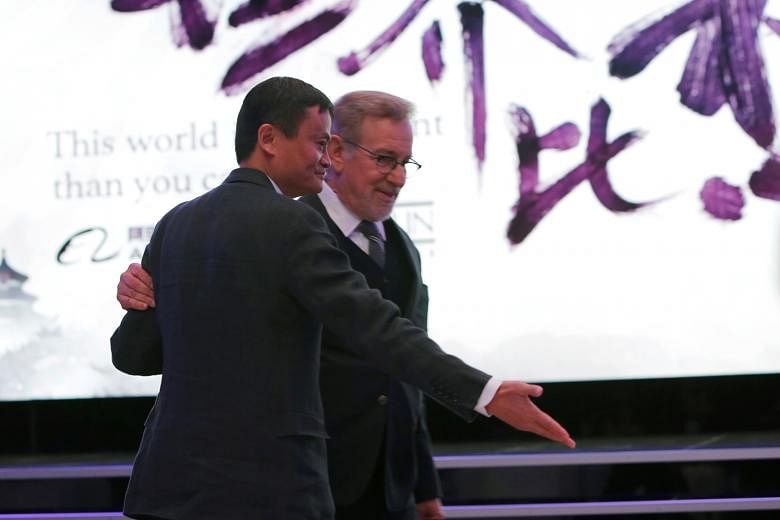 Mr Ma and Mr Spielberg at an event announcing the tie-up between their companies.