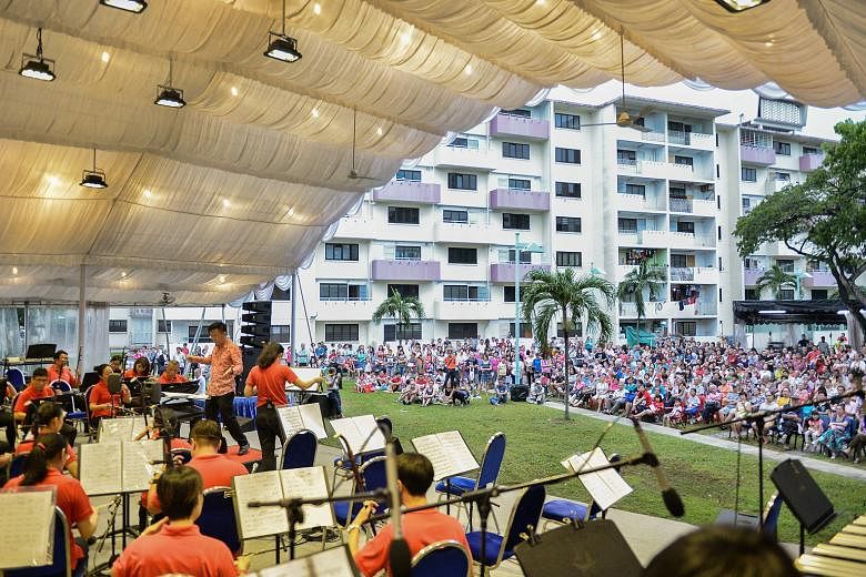 The Singapore Chinese Orchestra performing in a field beside Block 10 in Dakota Crescent in May. The estate in Mountbatten was built by the Singapore Improvement Trust in 1958.