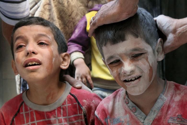 Syrian boys left distraught by Russian air strikes on the rebel-held Fardous neighbourhood in the embattled Syrian city of Aleppo.