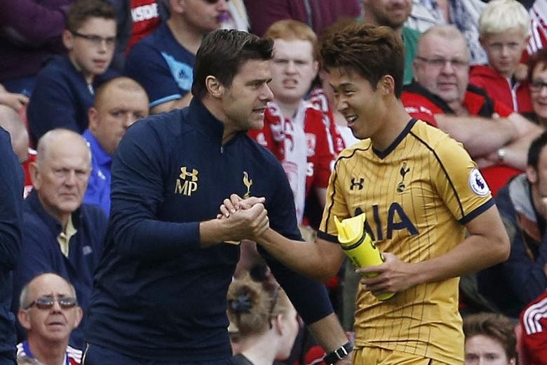 Tottenham manager Mauricio Pochettini (left) congratulates Son Heung Min after the forward scores against Middlesbrough in the Premier League. Spurs won that fixture last month 2-1 and are the only unbeaten side in England's top division this season.