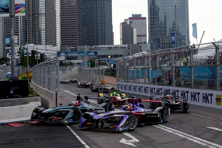 The Panasonic Jaguar Racing I-Type competed in the Formula E Championship Series, which started in Hong Kong. Drivers at the Formula E race going slow and steady at the first hairpin turn.