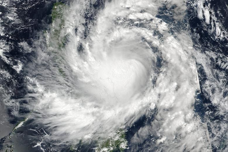 A Nasa image of Typhoon Sarika. The storm is expected to hit the main Philippine island of Luzon early today.
