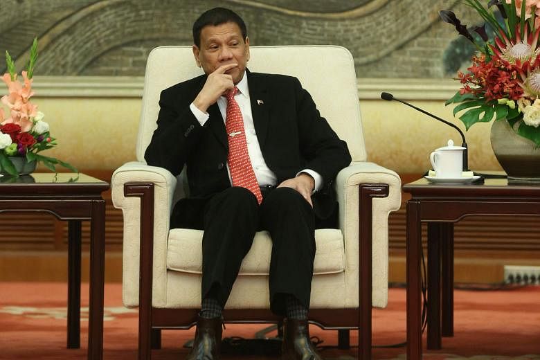 Mr Duterte at a meeting with top legislator Zhang Dejiang at Beijing's Great Hall of the People on Thursday. China is aware that he does not decide on his country's foreign policy on his own, said Chinese analysts.