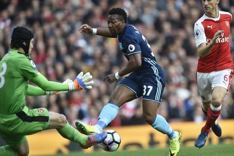 Arsenal stopper Petr Cech saving from Boro winger Adama Traore. The visitors took 11 shots at the Emirates Stadium, compared to Arsenal's nine. Boro hit the target four times.