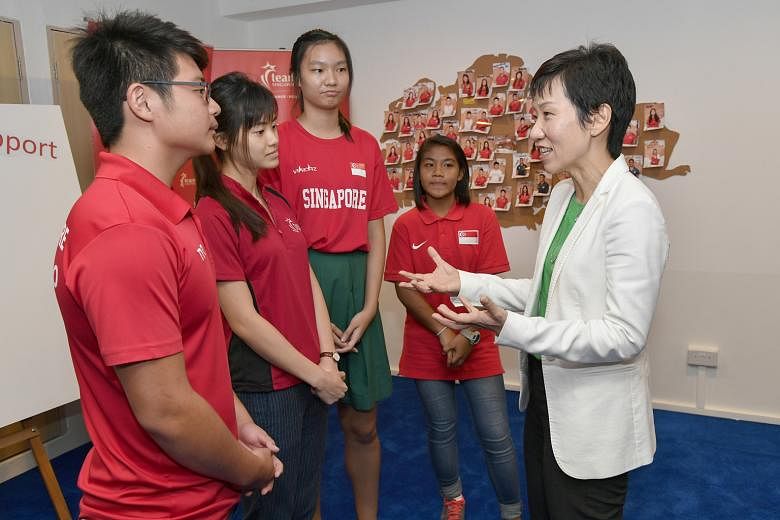 Ting Wai Piew, 15; Tan Shi Ni, 21; Choo Jie Ying, 17; and Mira Ruzana Seherzan, 15, chatting with Minister for Culture, Community and Youth Grace Fu at the launch of NYSI Satellite@ Kallang.