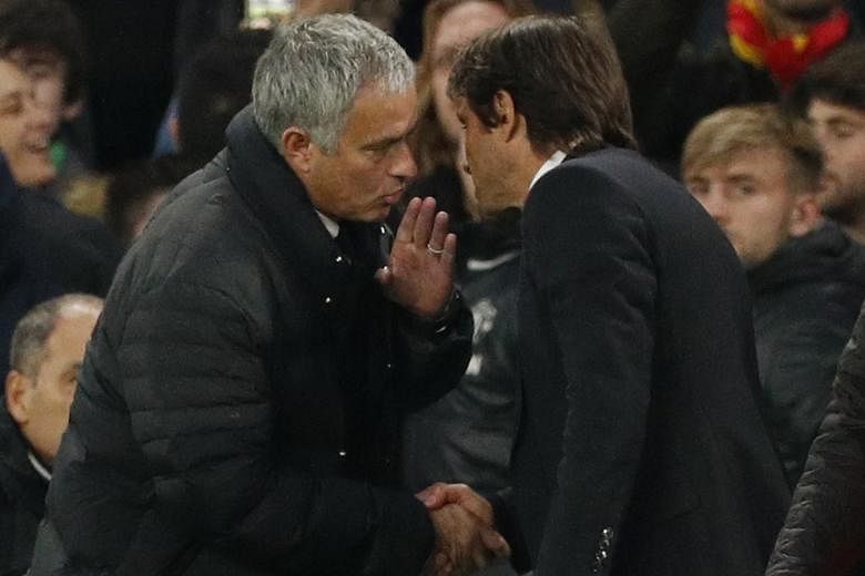 Jose Mourinho and his Chelsea counterpart Antonio Conte after the Blues won 4-0 at Stamford Bridge on Sunday. Neither man would divulge exactly what was said by the Manchester United manager in the touchline exchange.