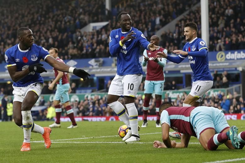 Everton striker Romelu Lukaku celebrating opening accounts for his side against West Ham with the provider of his goal, Yannick Bolasie (left). The Belgian's strike was his ninth in as many appearances against the Hammers.