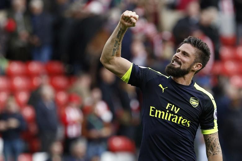 Arsenal striker Olivier Giroud celebrates after playing a vital role in his team's 4-1 victory at Sunderland on Saturday. The France international came off the bench to net a brace.