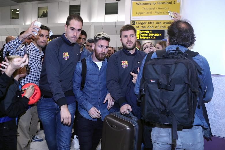 Barcelona superstar Lionel Messi (middle) arriving at Manchester Airport yesterday. City have never beaten Barca in the Champions League and need to find a way to stop Messi if the drought is to come to an end.