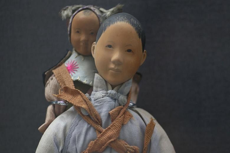 This Door Of Hope doll from the 1900s to 1940s, handcarved from pear wood and on loan from the Mint Museum Of Toys, is one of more than 30 artefacts on display at a special exhibition titled Museum Roundtable: A 20-year Journey. The exhibition, which