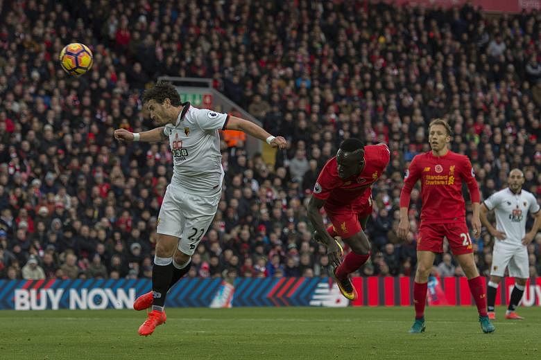 Liverpool's Sadio Mane stooping to head in the opening goal against Watford at Anfield. His double and strikes by Philippe Coutinho, Emre Can, Roberto Firmino and Georginio Wijnaldum gave the Reds a 6-1 win but manager Jurgen Klopp is not keen on any