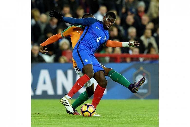 France's Paul Pogba, one of the few stalwarts who kept their starting spots, tries to control the ball against Ivory Coast.