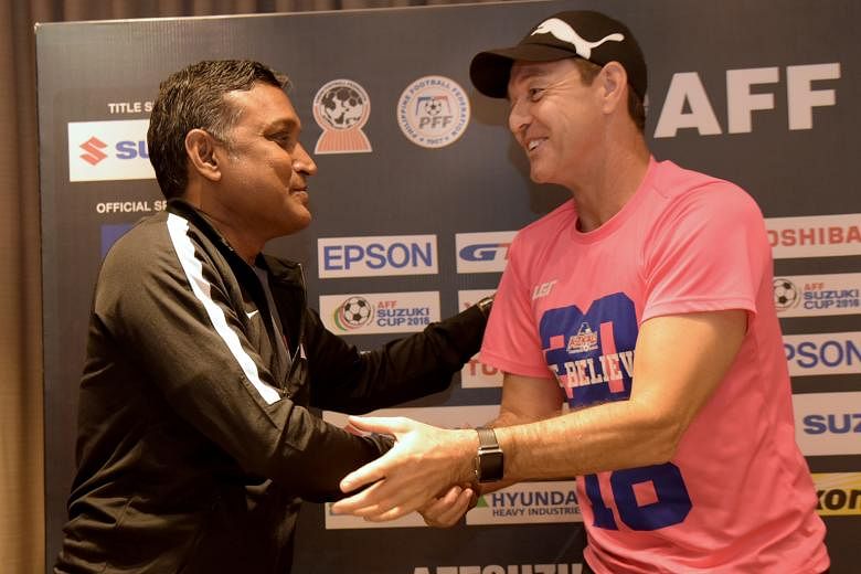 Singapore coach V. Sundramoorthy and his Philippines counterpart Thomas Dooley at the tournament's press conference yesterday. While Dooley, Thai coach Kiatisuk Senamuang and Alfred Riedl from Indonesia remained behind to speak to the media, Sundram 