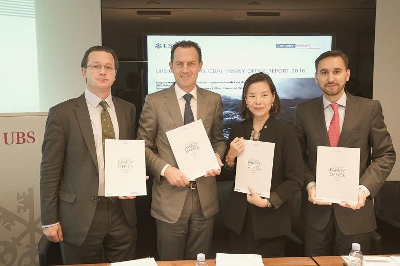 Presenting the latest Global Family Office Report are (from left) Campden Wealth CEO Dominic Samuelson, and UBS' Mr August Hatecke (head, wealth management, South-east Asia), Ms Patricia Quek (country team head, Ultra High Net Worth Singapore and Glo