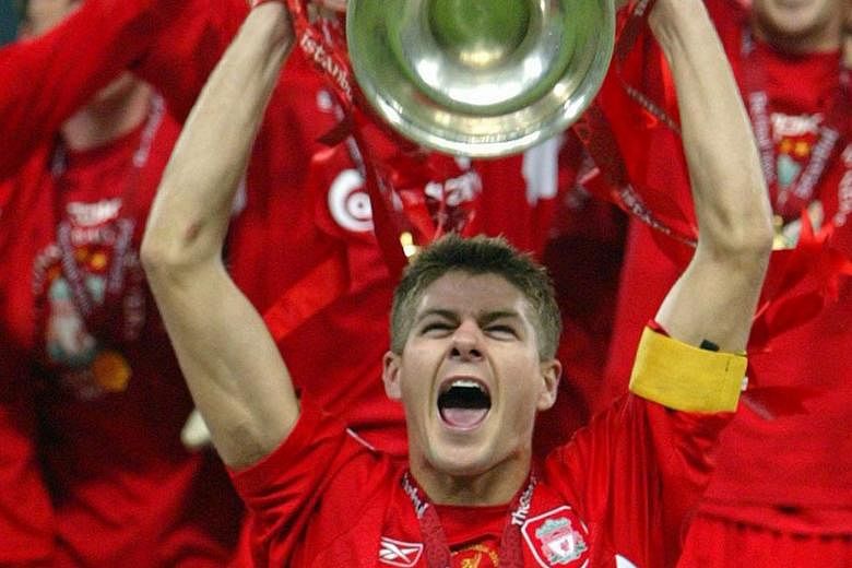 Above: The high point of Steven Gerrard's Liverpool career came when he lifted the Champions League trophy after the victory against AC Milan in Istanbul in 2005. Left: One of his greatest regrets was the failure to win an English top-flight title. T