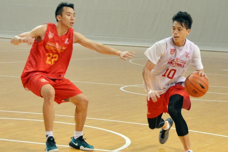 Singapore Slingers' Leon Kwek dribbling past fellow forward Kelvin Lim during team training at OCBC Arena. Besides their stamina, tight defence is also expected to help them go far in the competition.