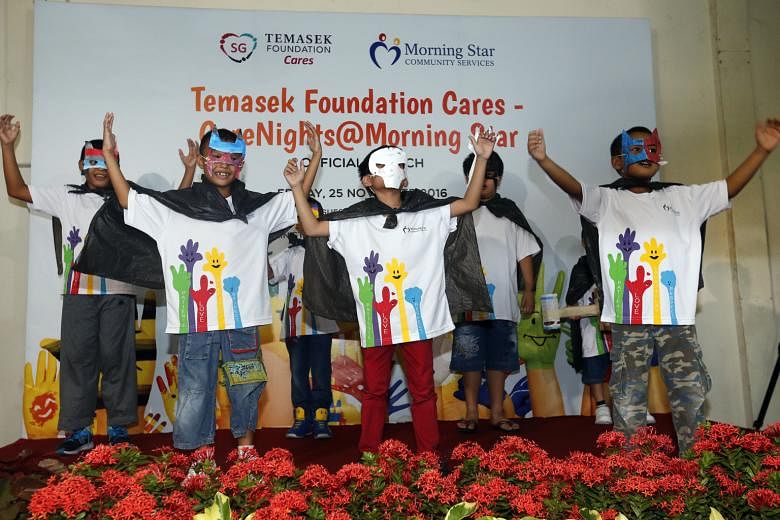 Children performing at the official launch of the CareNights@ Morning Star programme yesterday, at a void deck next to a Morning Star Community Services student care centre in Block 95, Bedok North Avenue 4. The free student care service is being pil