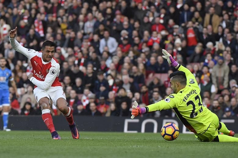 Alexis Sanchez opening the account for Arsenal, after intercepting Bournemouth defender Steve Cook's back pass to beat Adam Federici. The Chilean scored another in the 3-1 win to take his Premier League tally to eight.
