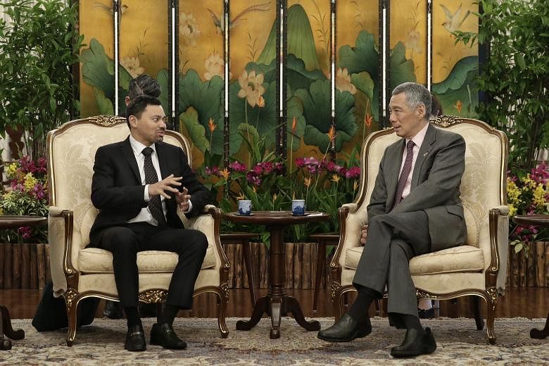 Brunei's Crown Prince Al-Muhtadee Billah (left), in town for the fourth Singapore-Brunei Young Leaders' Programme, calling on Singapore PM Lee Hsien Loong at the Istana yesterday.