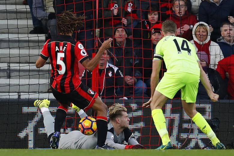 Bournemouth's Nathan Ake scores the dramatic 93rd-minute winner in the 4-3 win against Liverpool yesterday, their maiden victory against the Reds since the two sides first met in 1927.