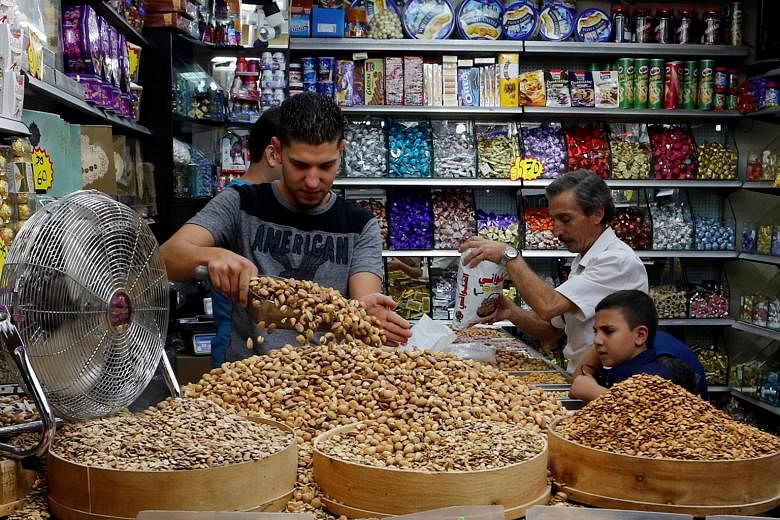 A shop in Jerusalem selling sweets and nuts. Nuts are high in protein and fat.