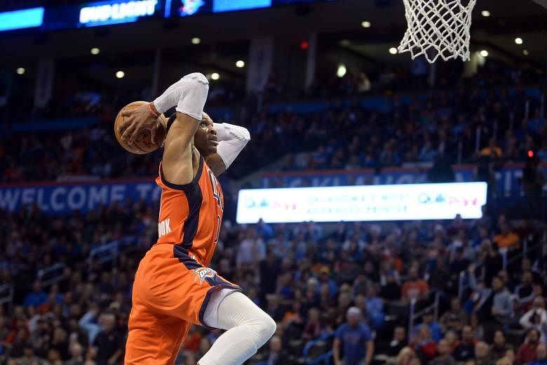 Oklahoma City point guard Russell Westbrook going airborne to notch two of his 37 points with an emphatic dunk during the Thunder's 99-96 win over the Boston Celtics.