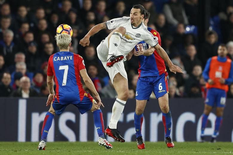 Manchester United's Zlatan Ibrahimovic battling for the ball with Crystal Palace midfielder Yohan Cabaye during their Premier League game on Wednesday. In a separate off-the-ball incident between the two, the striker has been spared further punishmen