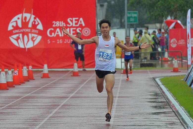 Singapore's Soh Rui Yong celebrates as he approaches the finishing line for the marathon at last year's SEA Games. Prior to this victory on home soil, he had spent a month training at Flagstaff, Arizona.