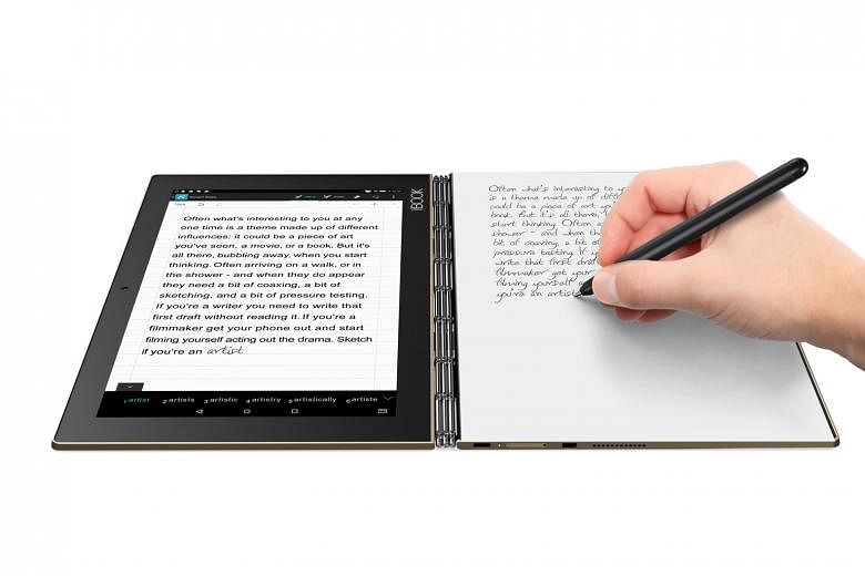 The Yoga Book consists of two halves - a 10-inch touchscreen and the Create Pad, a flat slate with the faint outline of a keyboard.