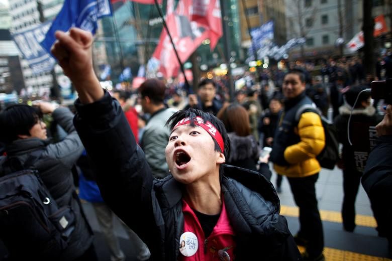 A protester chanting during a general strike in Seoul last month calling for President Park to step down.