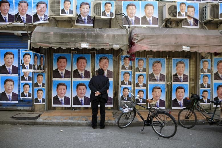 A building in Shanghai covered in posters of President Xi Jinping. To deal effectively with external uncertainties, China and Mr Xi will need to first address its internal troubles, says Prof Wang Gungwu of the East Asian Institute.
