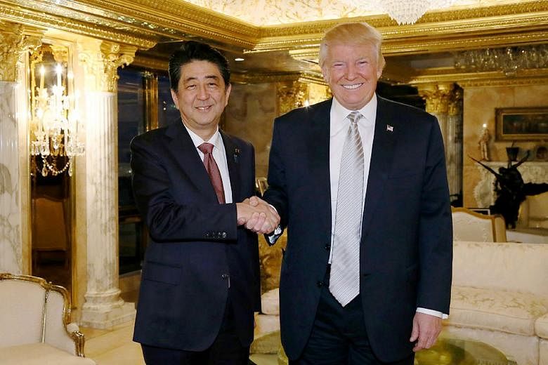 Mr Abe with Mr Trump in New York last month. Securing the President-elect's commitment to East Asia will be a key priority for Mr Abe.
