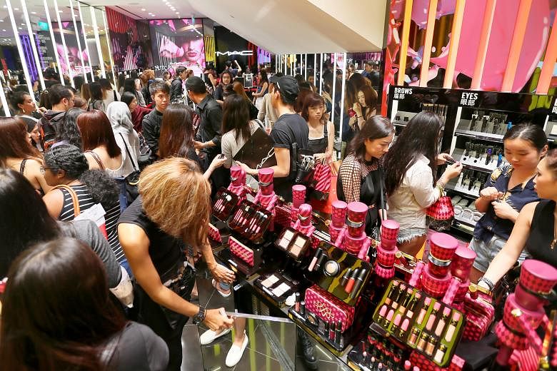 Shoppers at the opening of MAC Cosmetics' 1,980 sq ft flagship outlet in ION Orchard last month. Nars Cosmetics will open its first boutique in Ngee Ann City later this month while Urban Decay launched its first boutique in VivoCity in 2015.